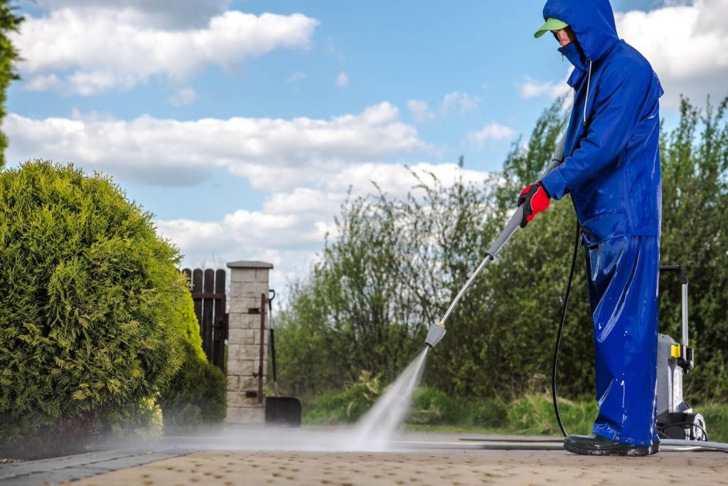 Driveway sidewalk is bing cleaned with Pressure washing in Melbourne, FL